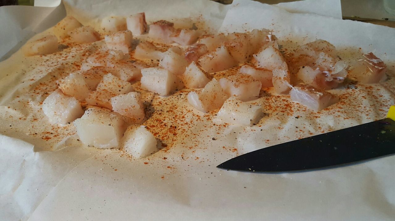 High angle view of fish on cutting board