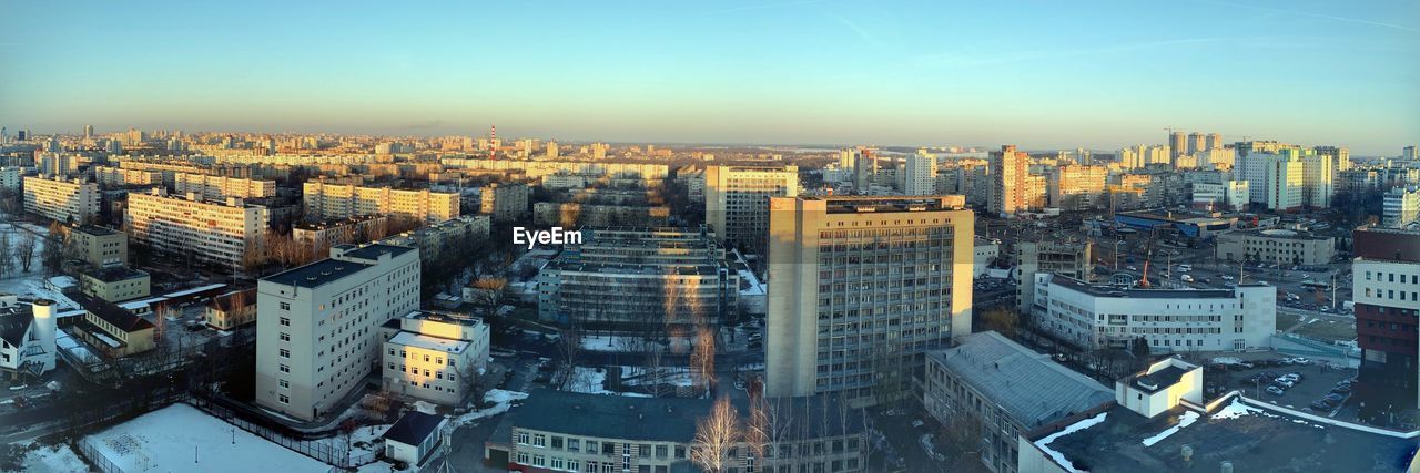 High angle view of modern buildings in city against sky