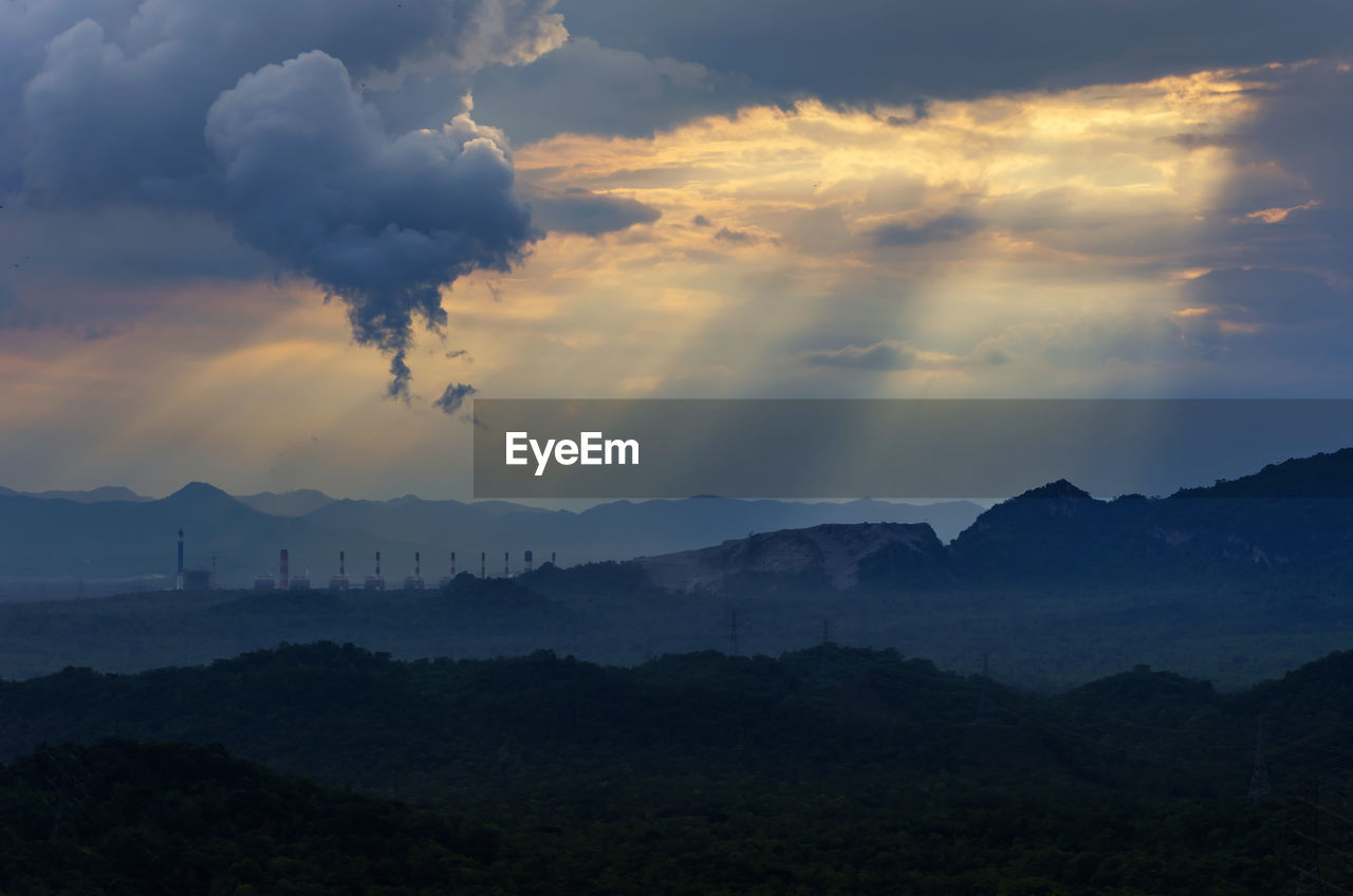 Scenic view of silhouette mountains against sky during sunset