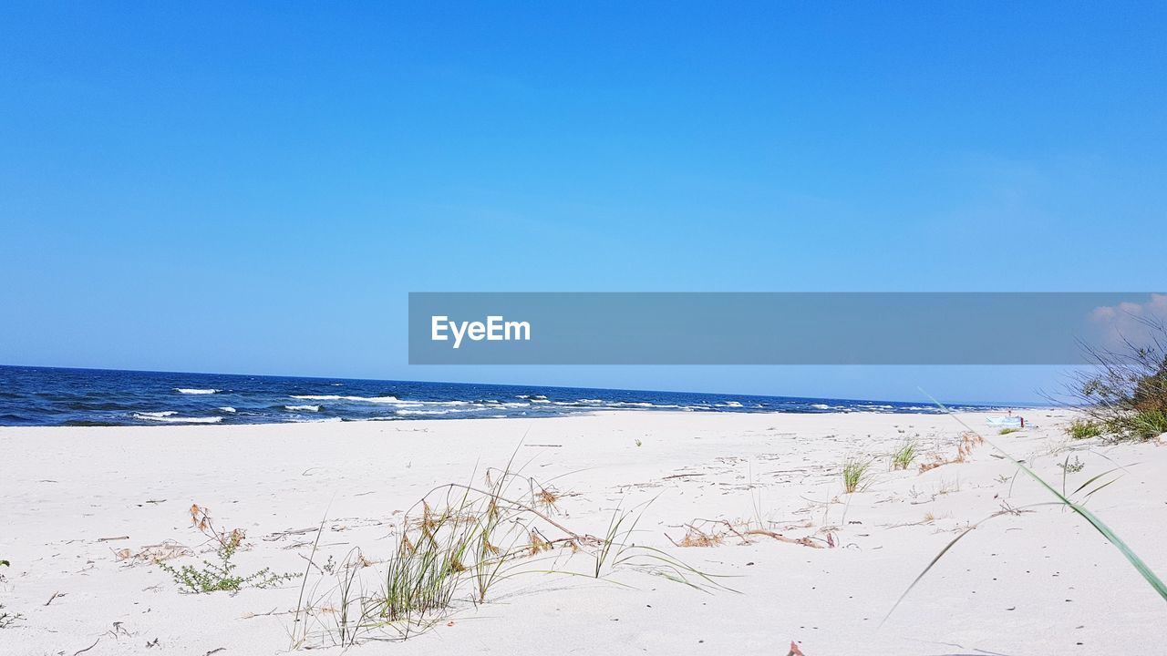 SCENIC VIEW OF SEA AGAINST BLUE SKY