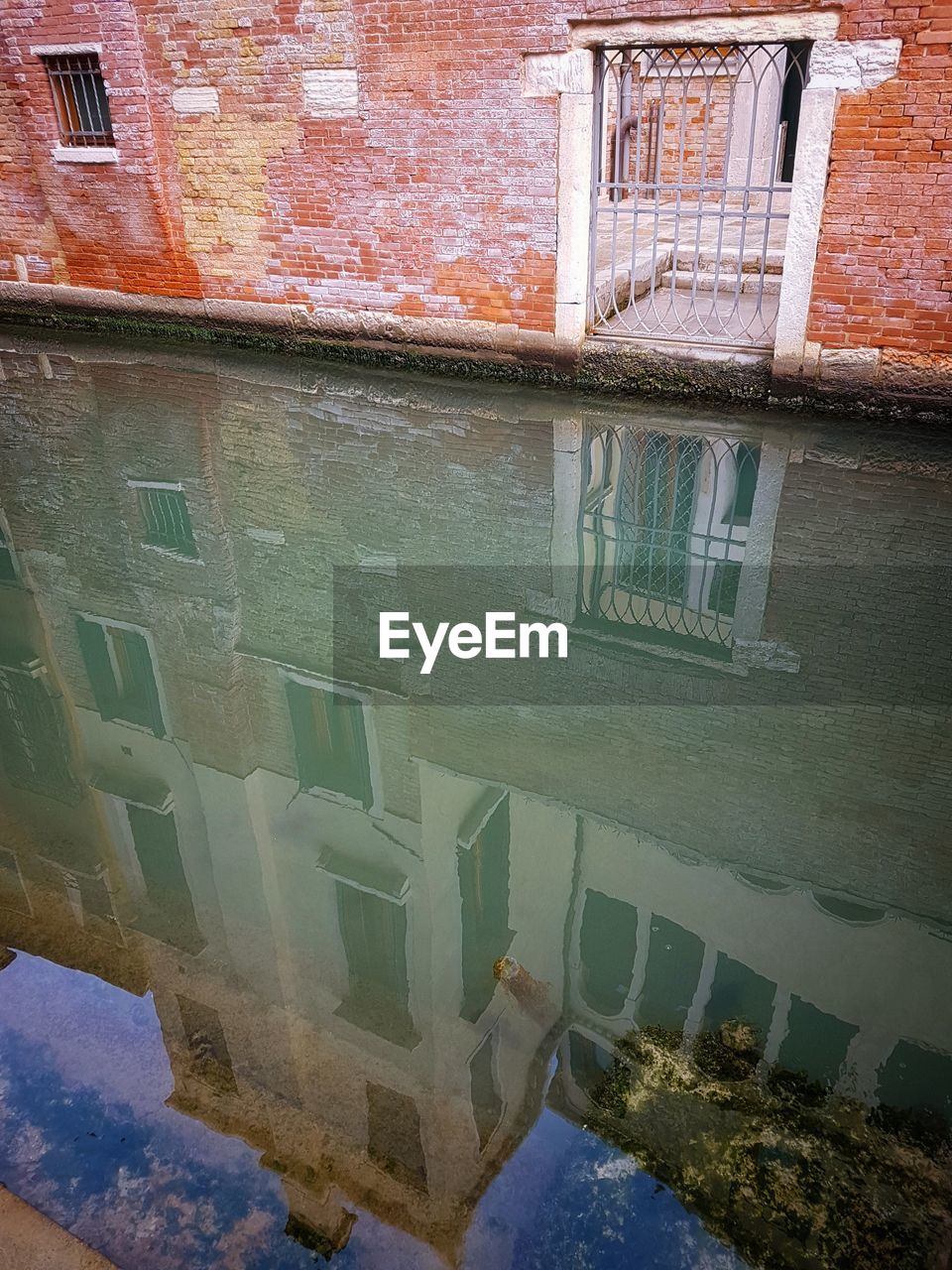 REFLECTION OF BUILT STRUCTURE IN WATER