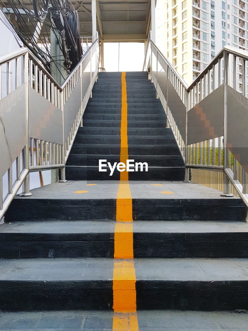 Low angle view of empty staircase against building