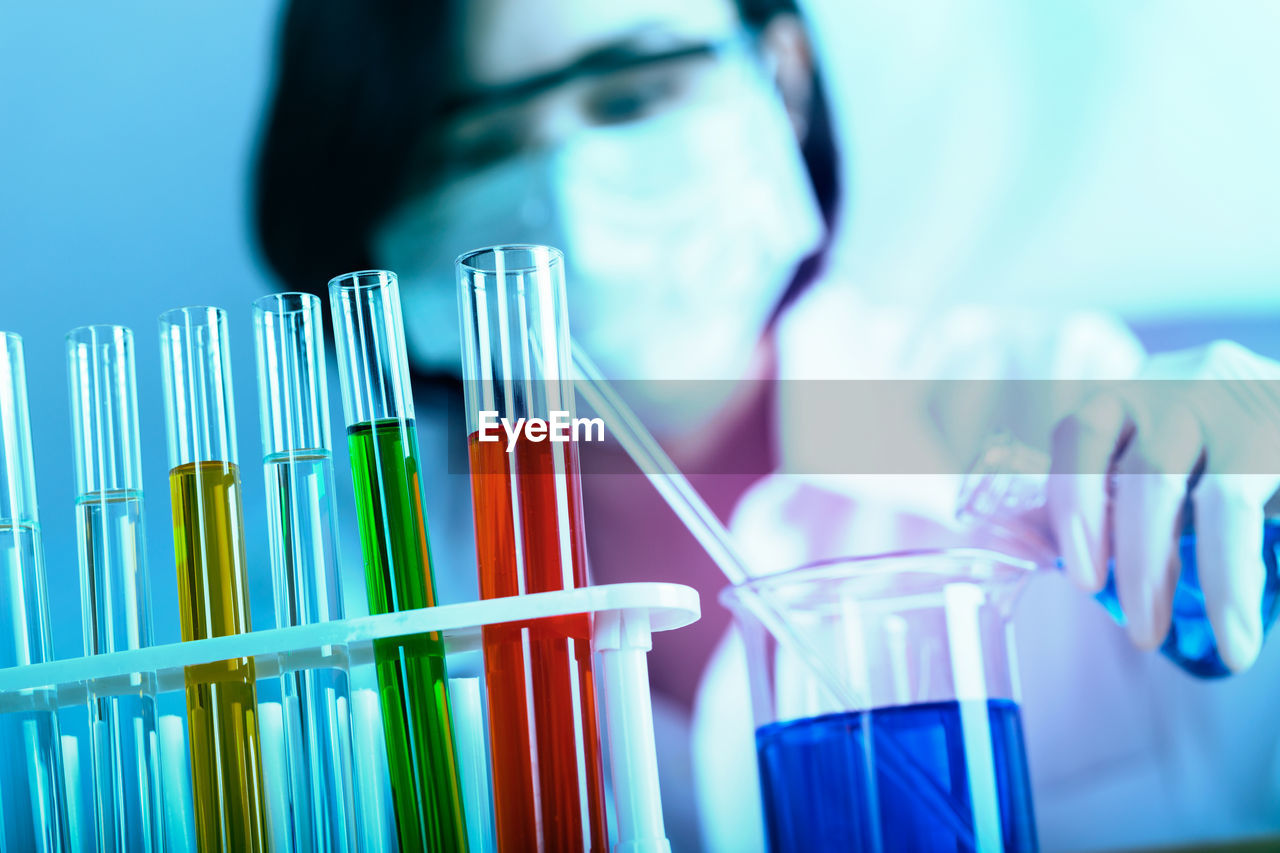 Female scientist holding medical sample at laboratory