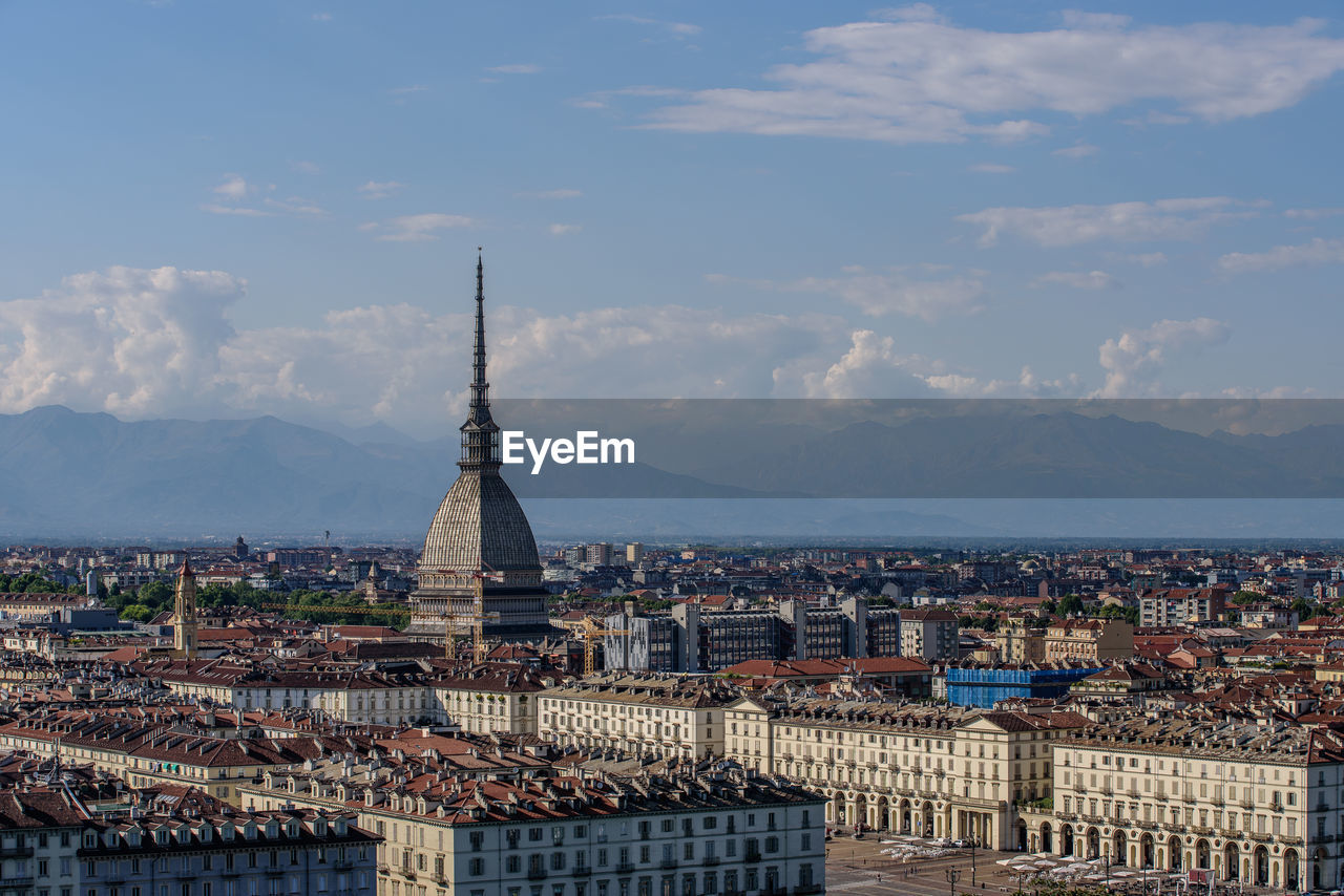 High angle view of city lit up against sky, turin, piedmont, italy