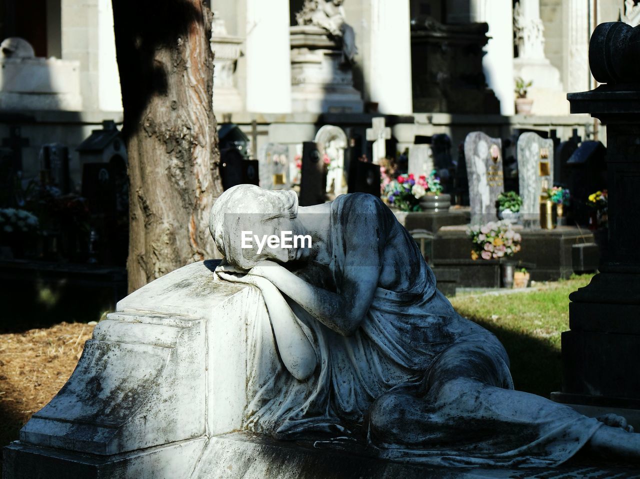 Female sculpture in cemetery