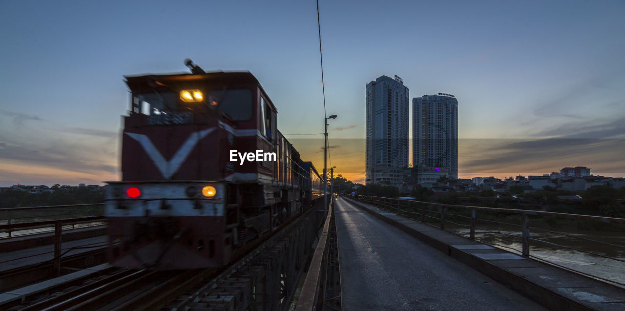 Train in city against sky