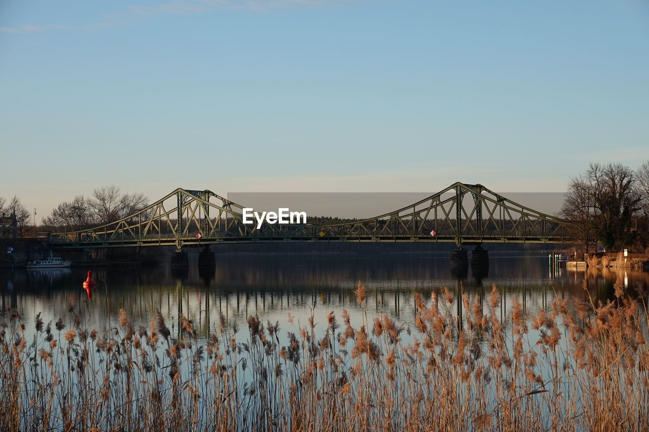 Bridge over river against clear sky