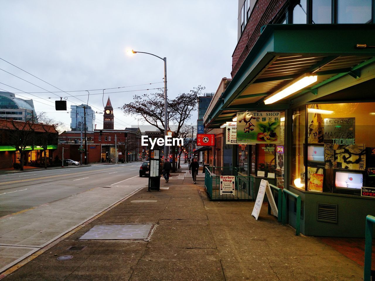 View of street in city at dusk