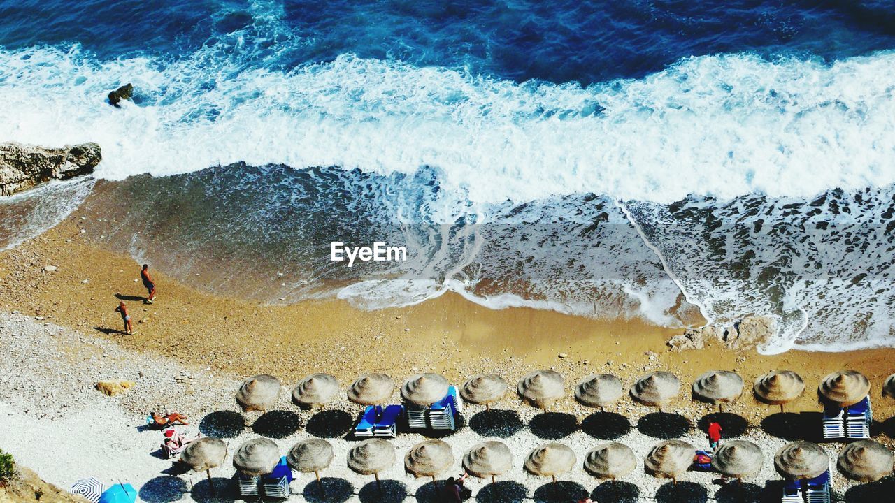 Aerial view of parasols at beach