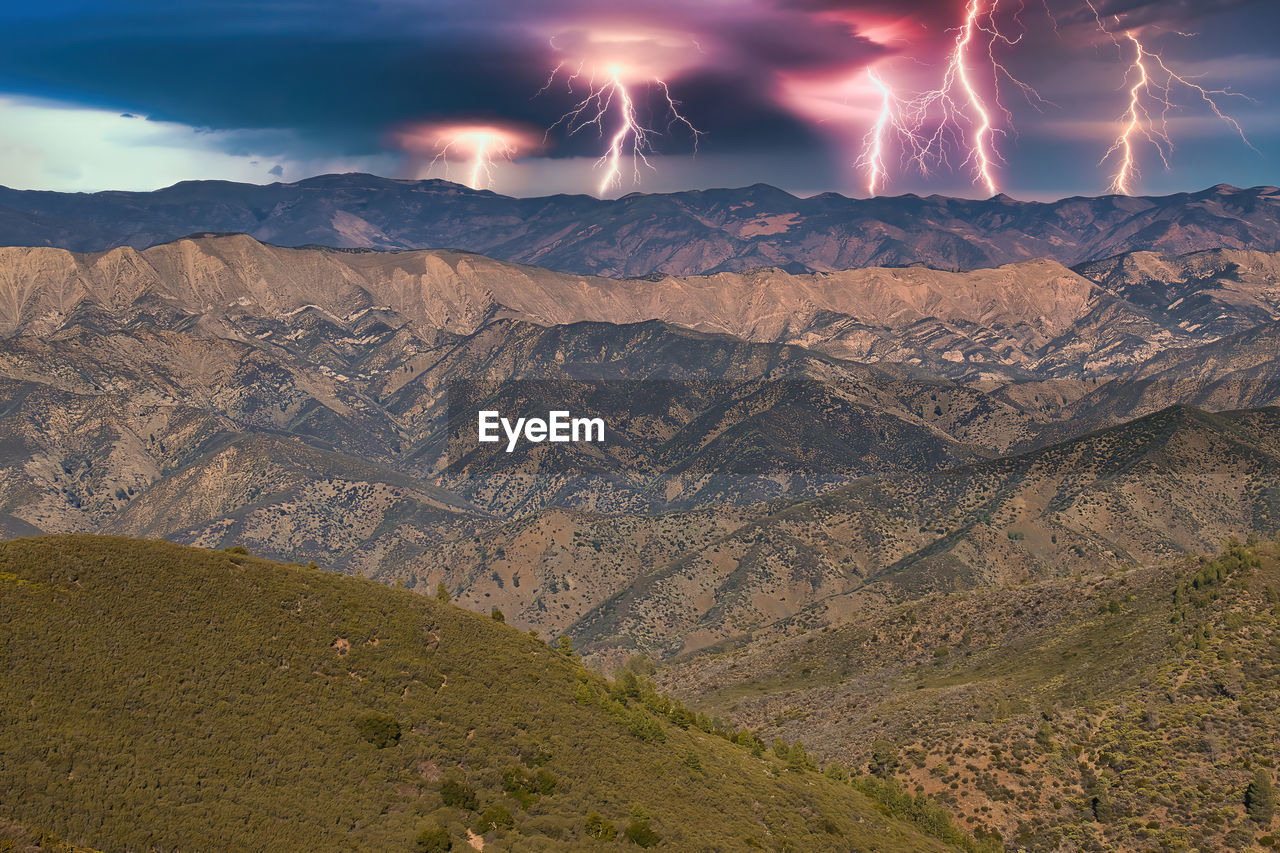 FIREWORK DISPLAY OVER MOUNTAIN