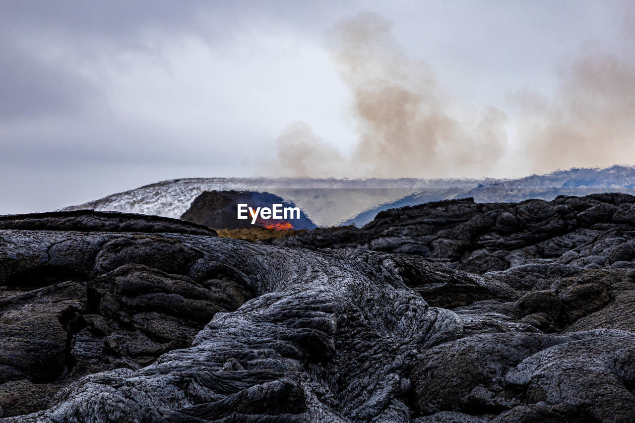 Scenic view of volcanic mountain against sky