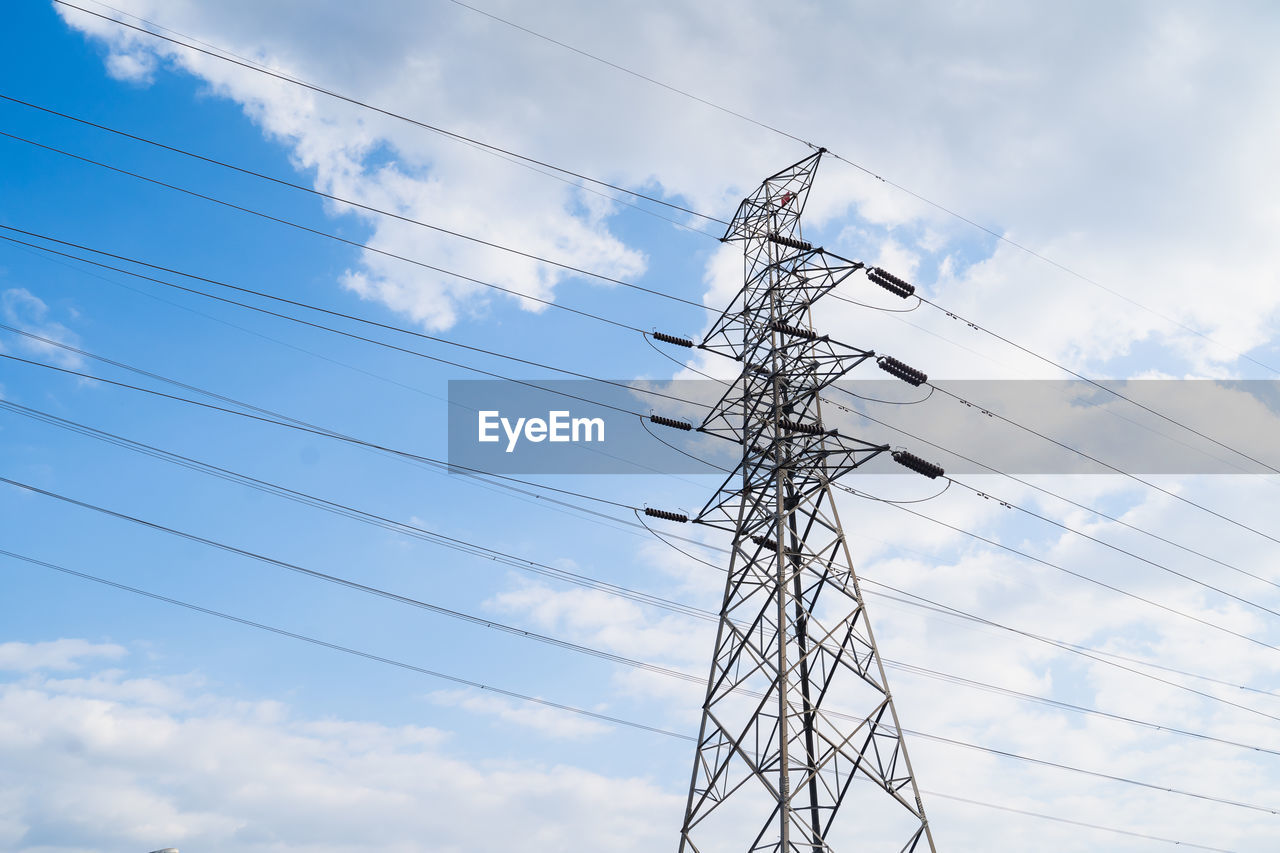 LOW ANGLE VIEW OF POWER CABLES AGAINST SKY