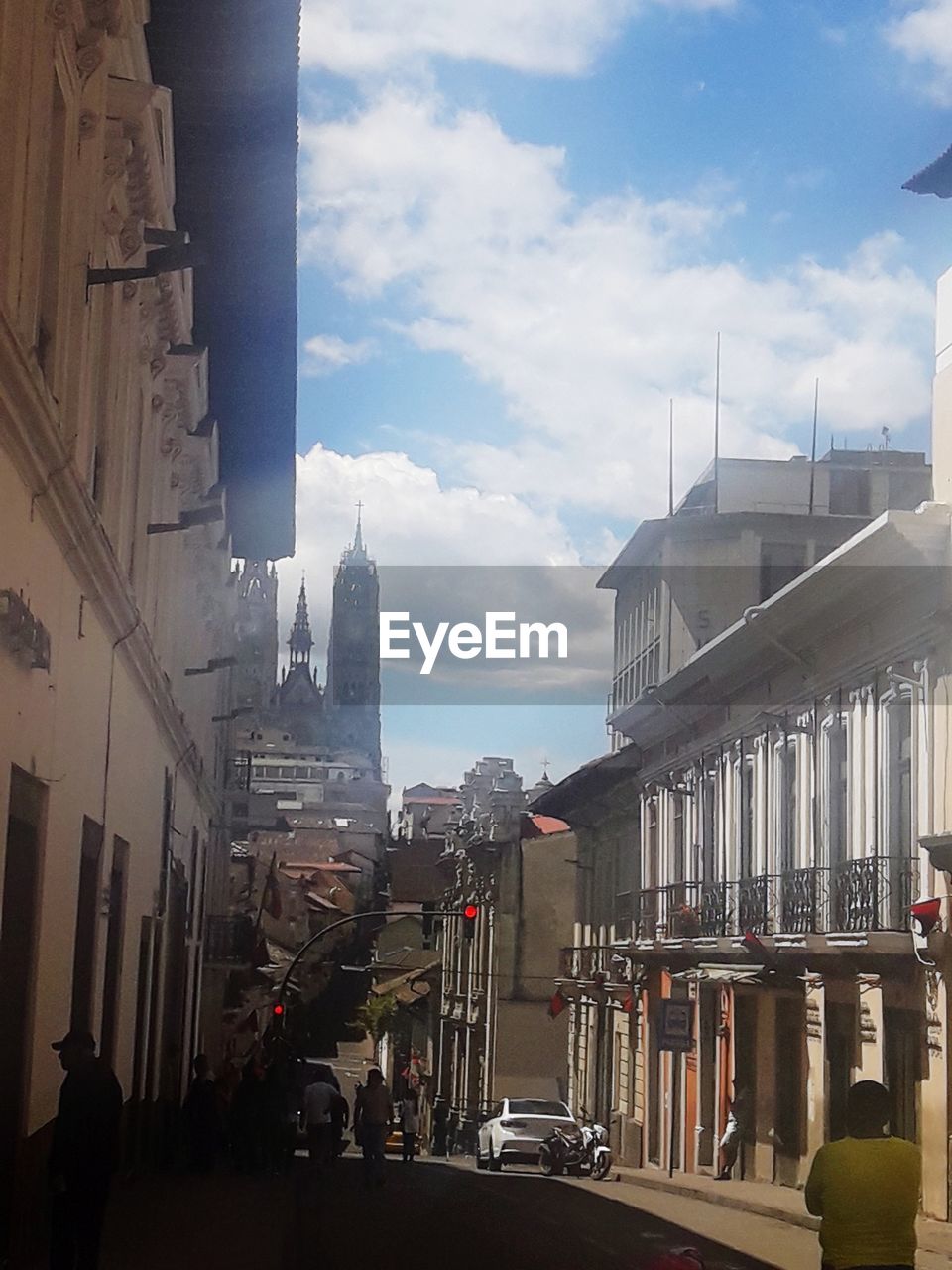 VIEW OF CITY STREET AND BUILDINGS AGAINST SKY