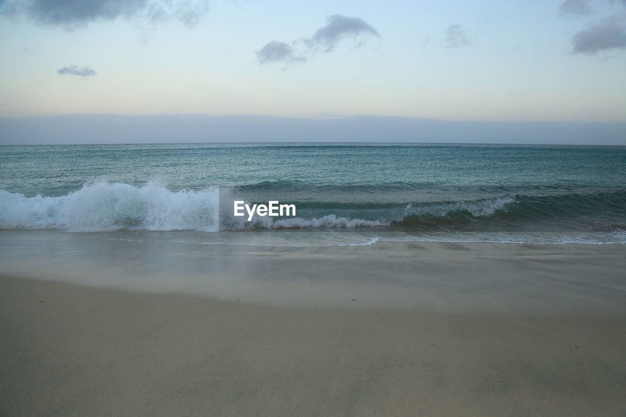 Scenic view of beach against sky