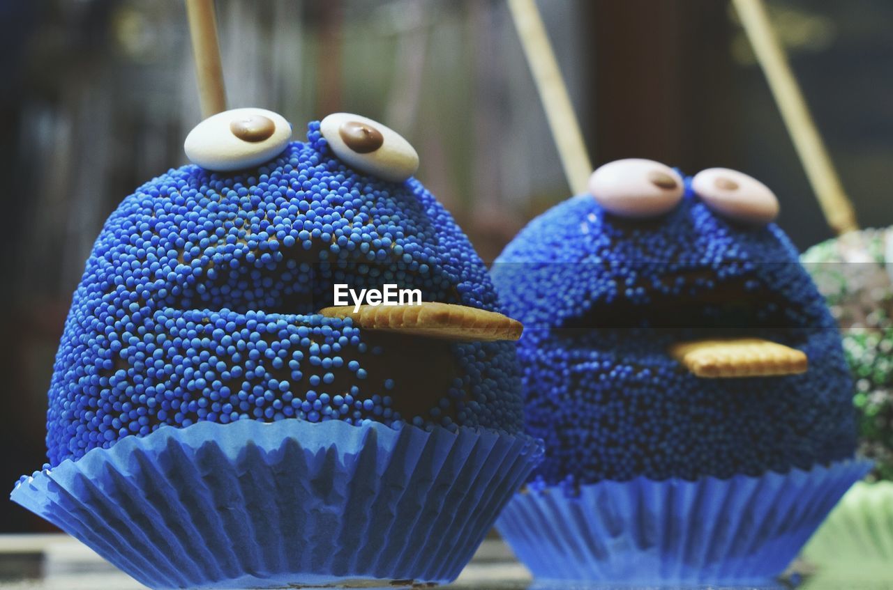 CLOSE-UP OF ICE CREAM WITH BLUE AND CANDIES