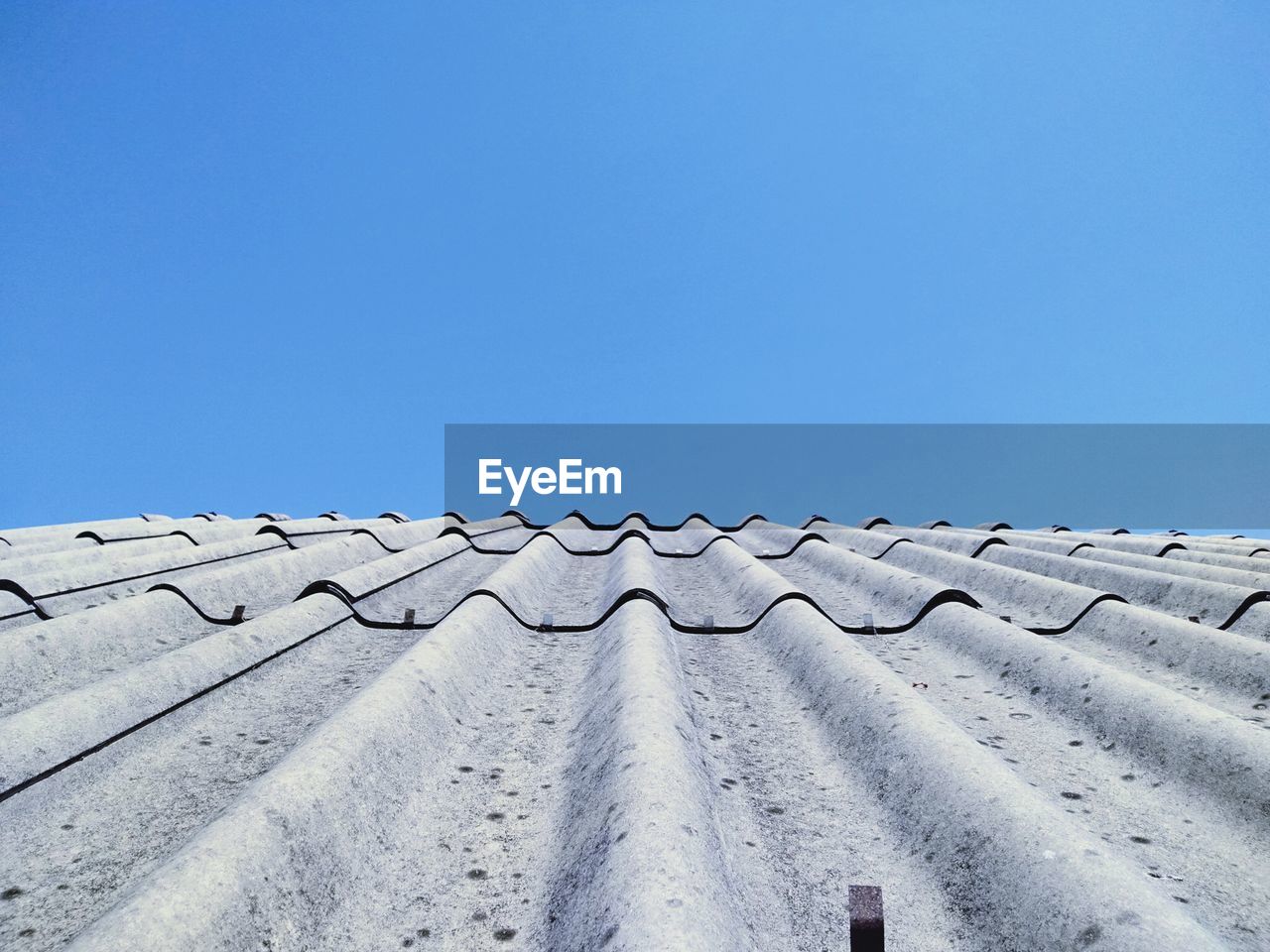 Low angle view of building against clear blue sky