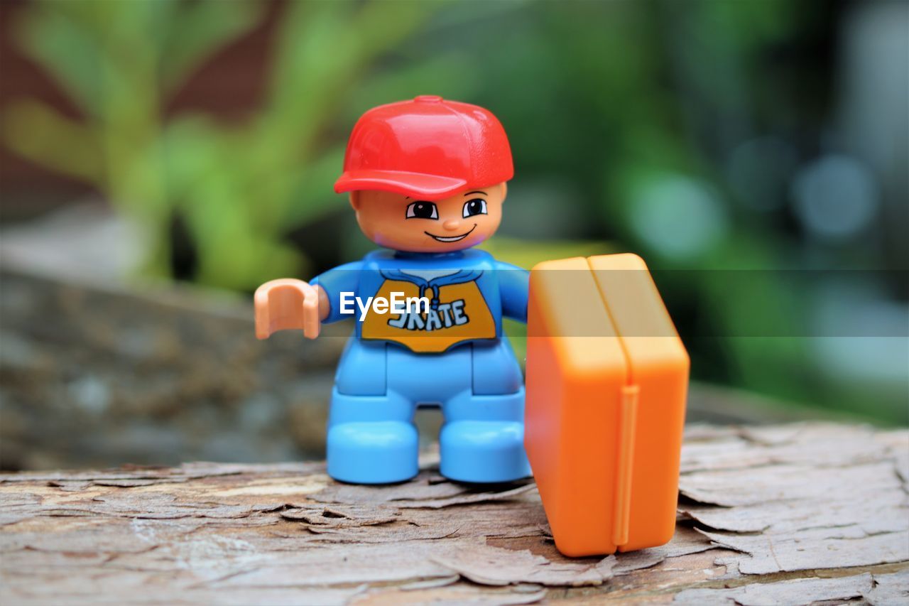 CLOSE-UP OF TOY ON TABLE