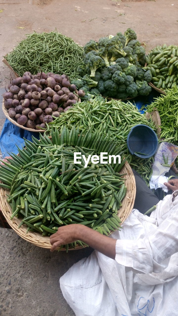 Low section of vendor selling vegetables