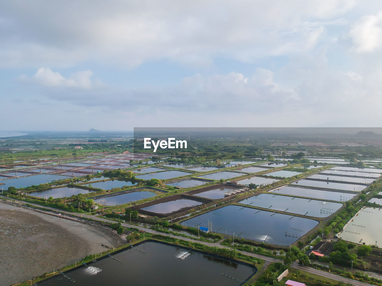 Aerial view of agricultural field against sky