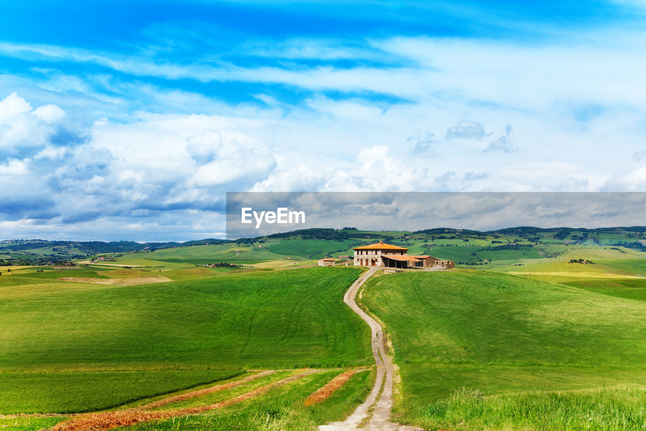 Scenic view of farm against sky