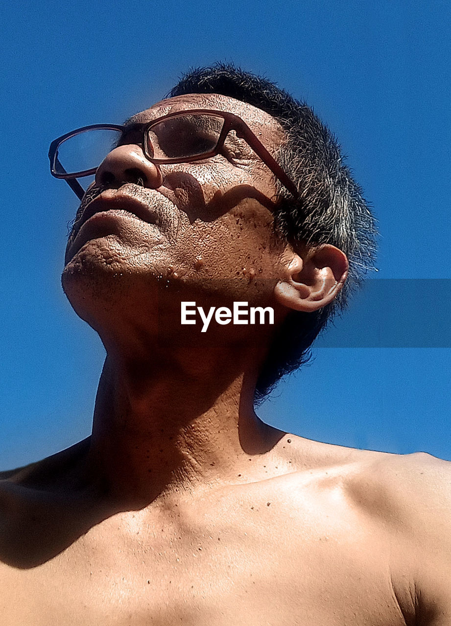 PORTRAIT OF SHIRTLESS MAN