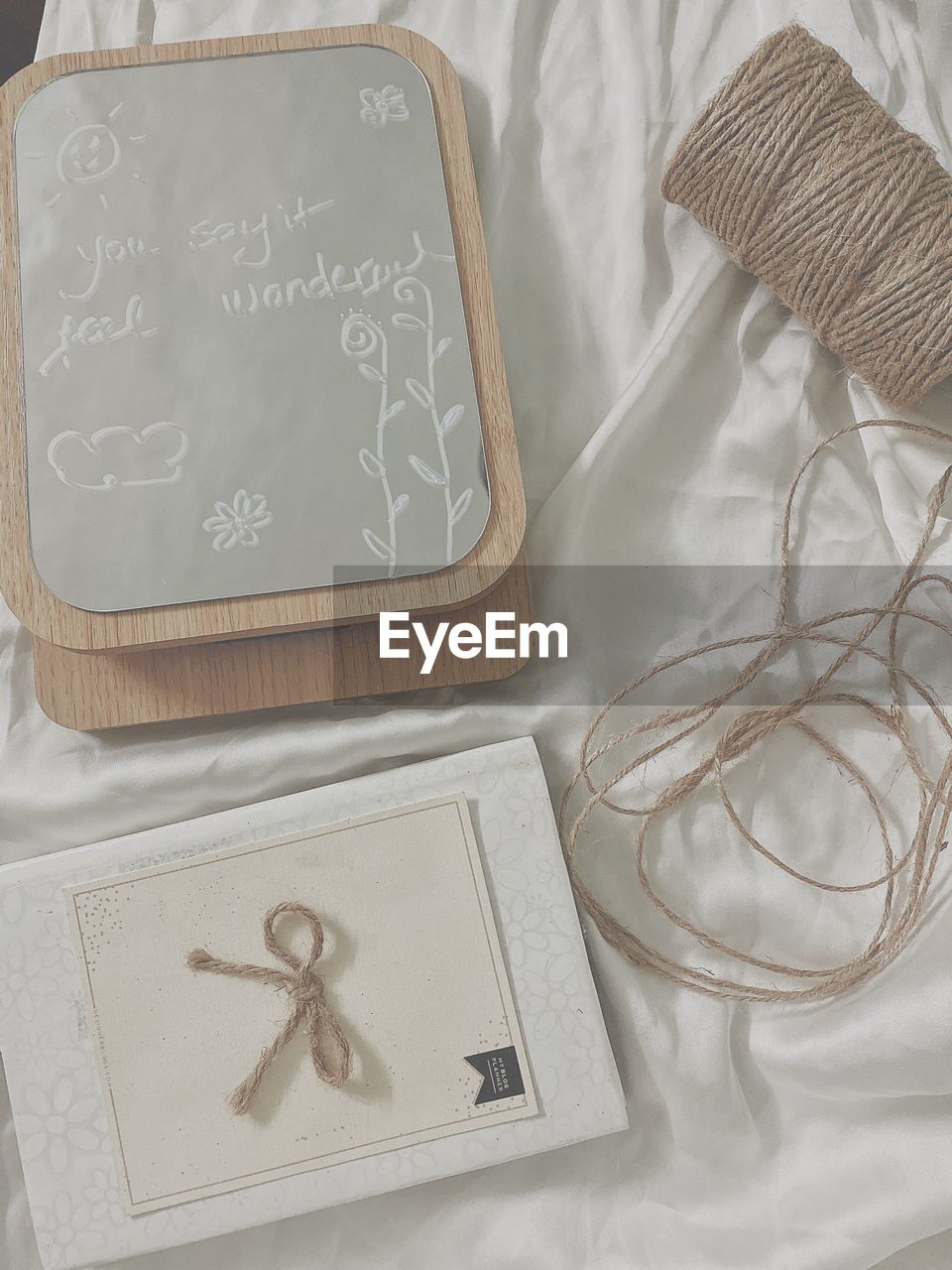 High angle view of greeting card and spool on table