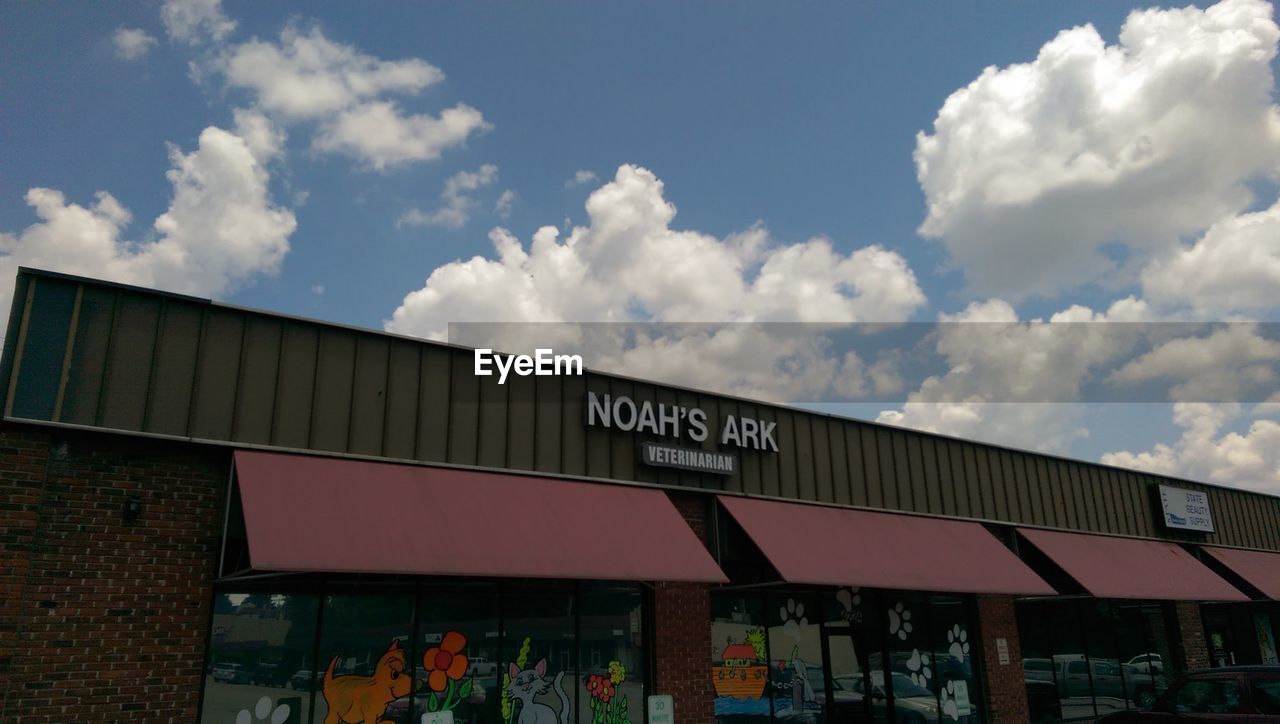 LOW ANGLE VIEW OF INFORMATION SIGN AGAINST SKY