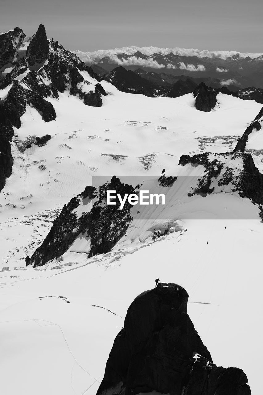 SCENIC VIEW OF SNOWCAPPED MOUNTAINS DURING WINTER