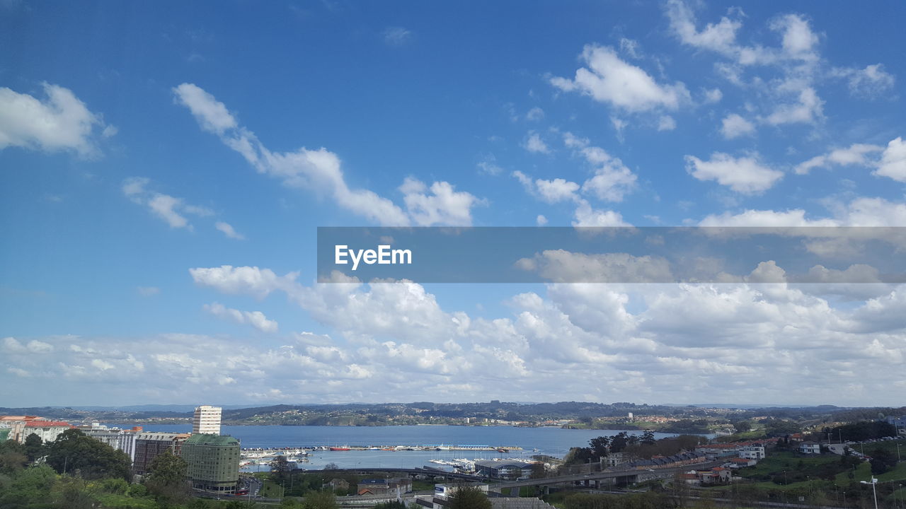 Cityscape against cloudy sky