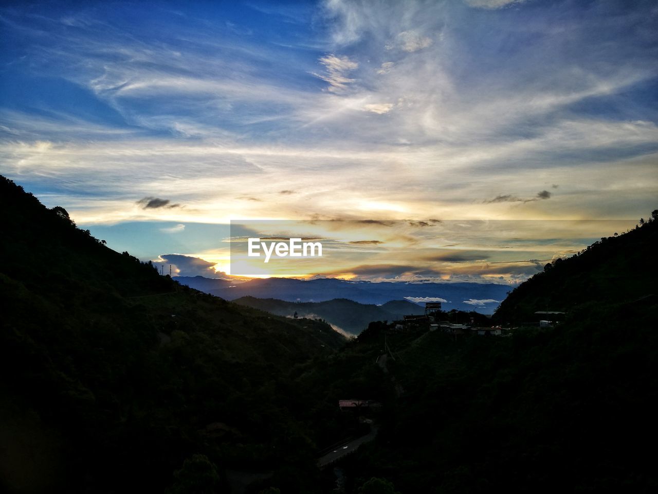 SILHOUETTE MOUNTAINS AGAINST SKY DURING SUNSET