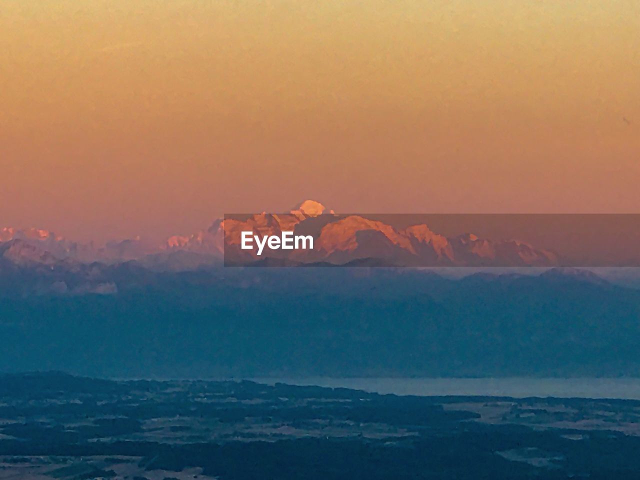 SCENIC VIEW OF MOUNTAINS DURING SUNSET