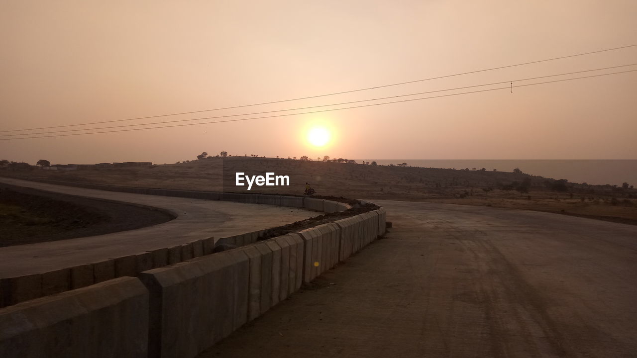 VIEW OF LANDSCAPE AT SUNSET