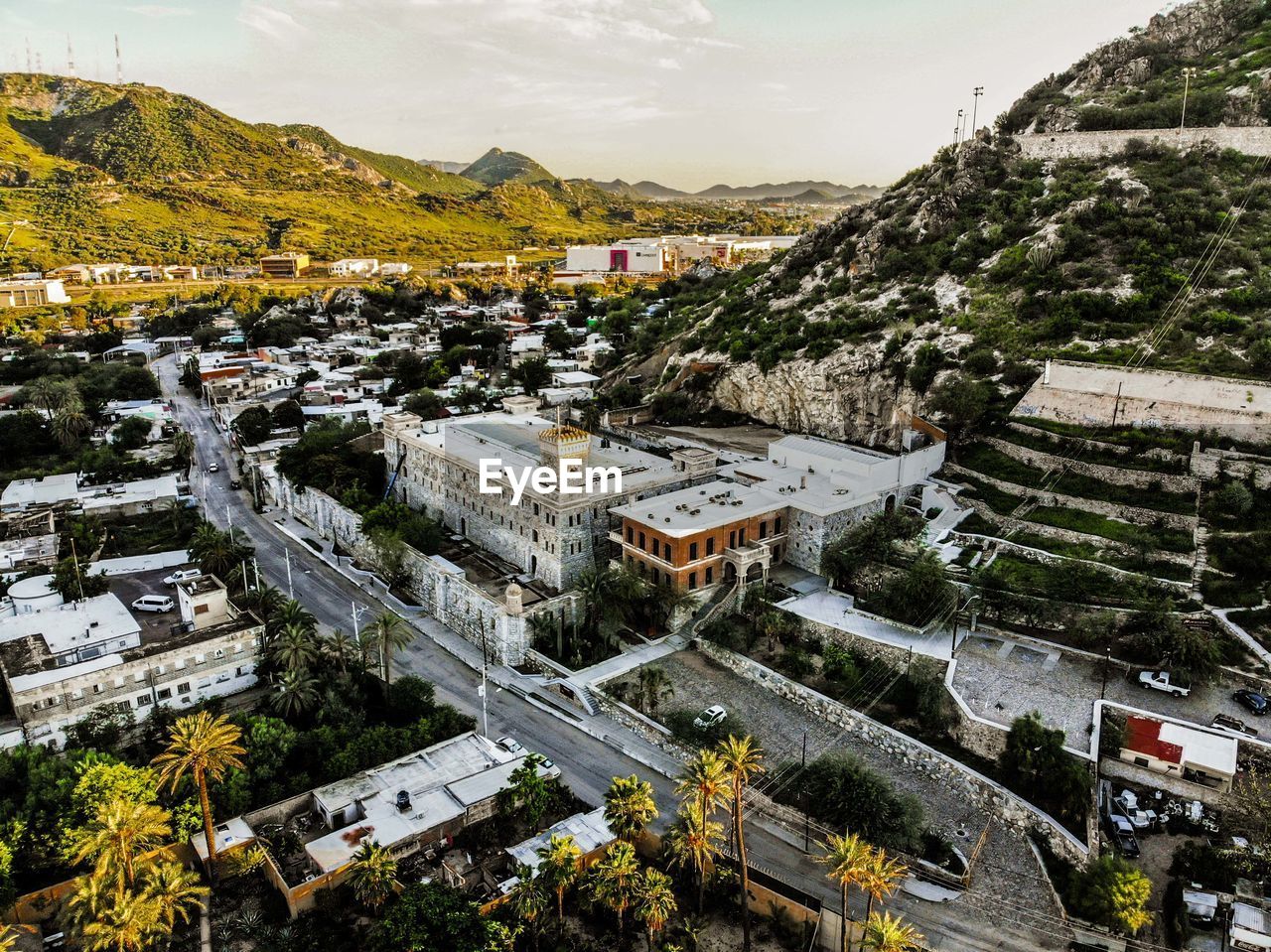 HIGH ANGLE VIEW OF BUILDINGS AND STREET IN CITY