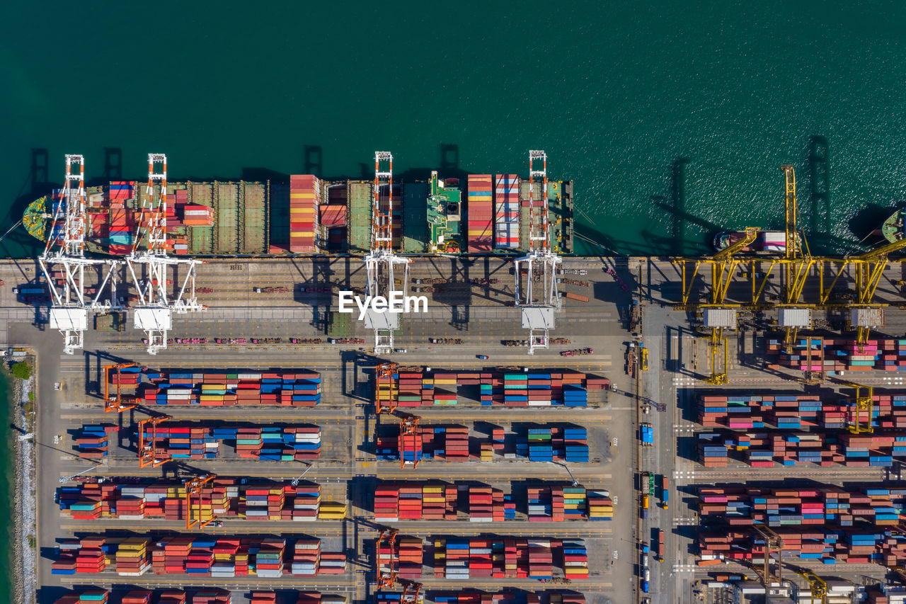 Stack of multi colored containers box and containers ship top view 