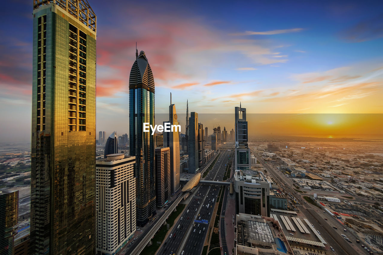 Cityscape against sky during sunset