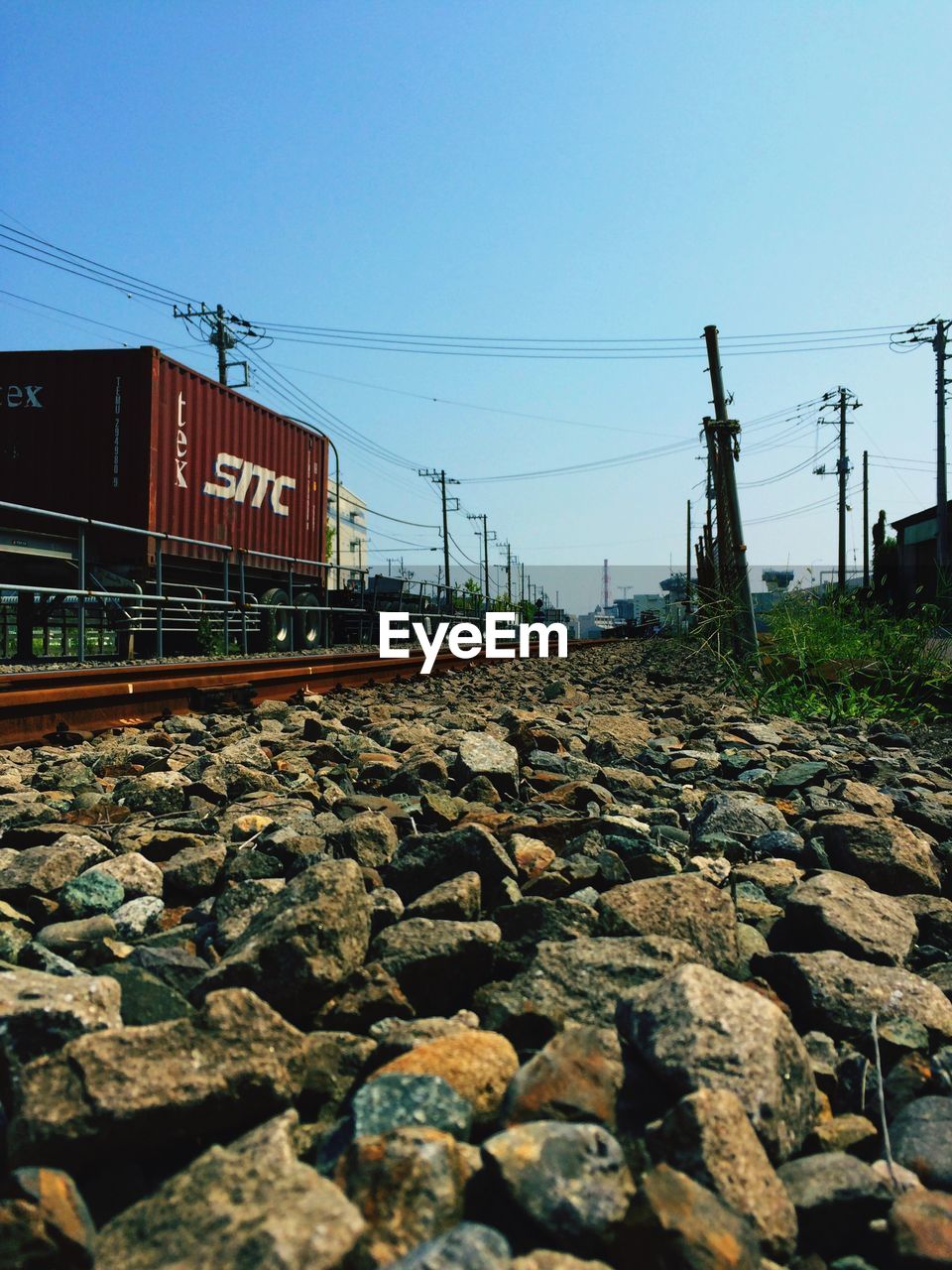 VIEW OF RAILROAD TRACKS AGAINST CLEAR SKY