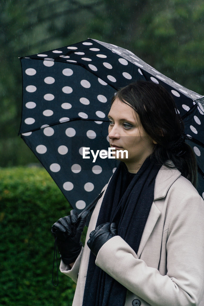 portrait of young woman with umbrella