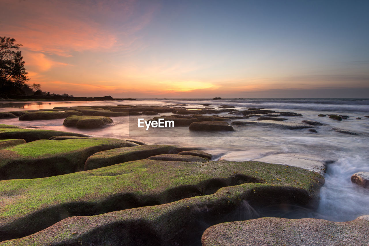 Scenic view of sea against sky during sunset