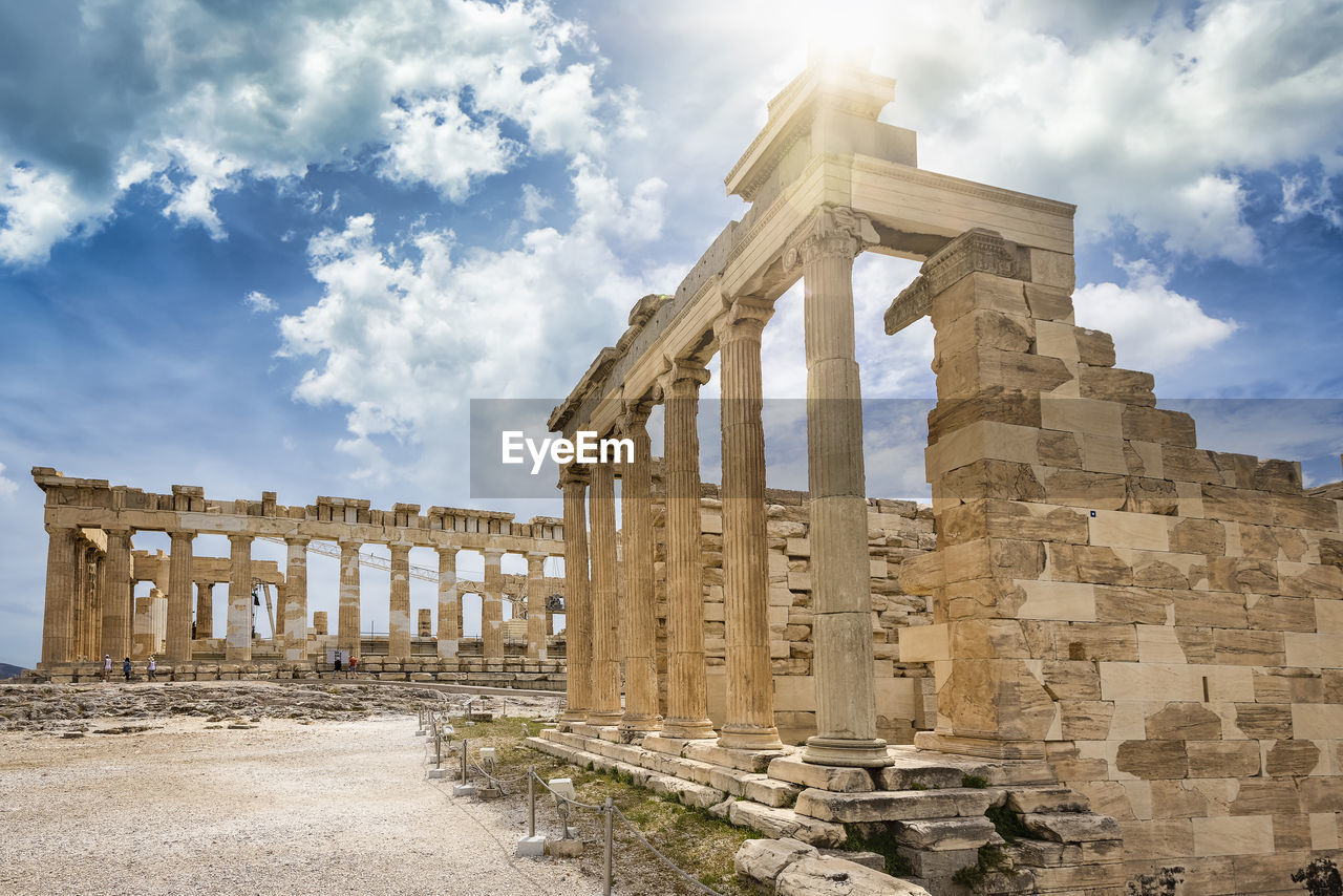 Old ruins of temple against cloudy sky