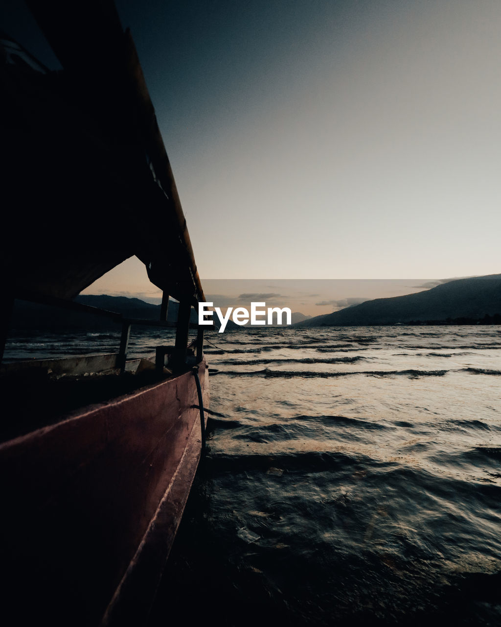 Scenic view of sea against clear sky during sunset