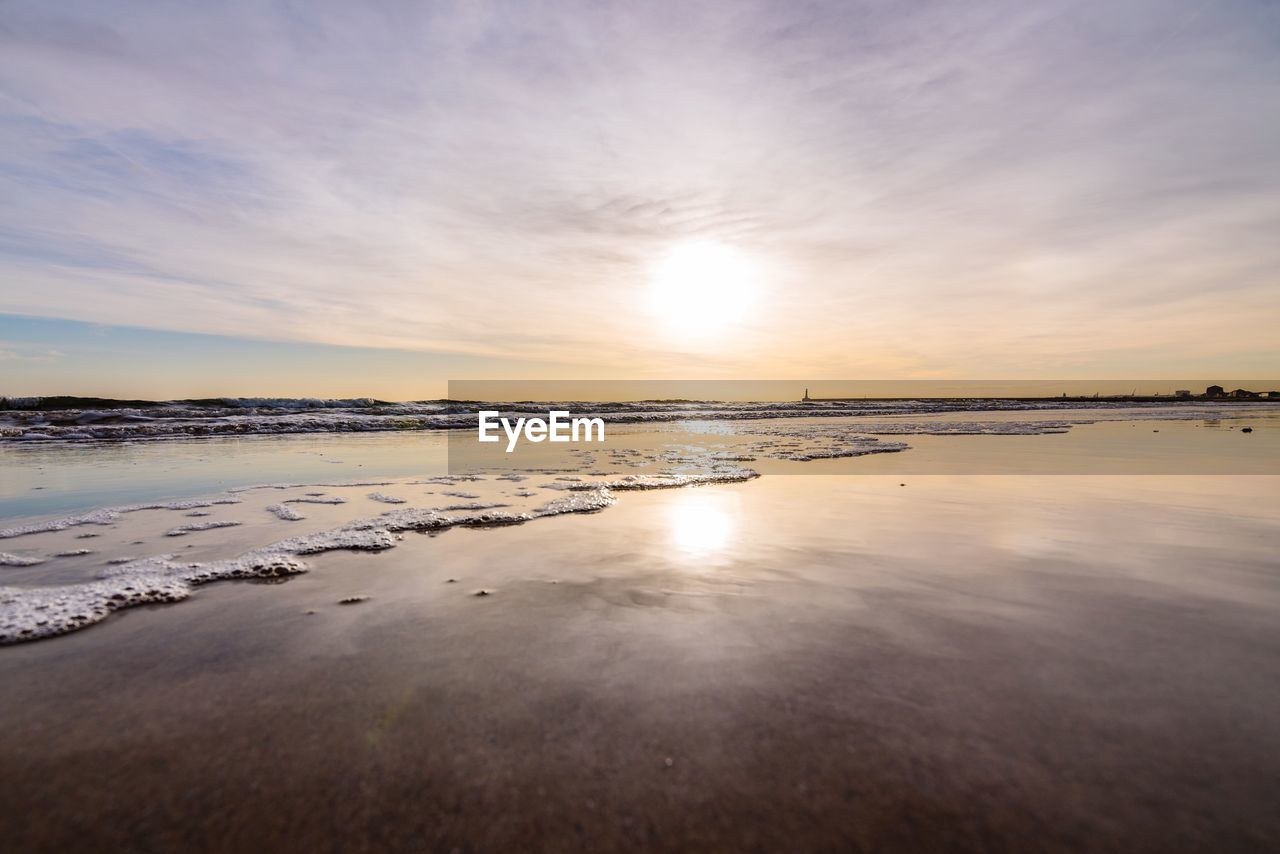 Scenic view of sea against sky at sunset