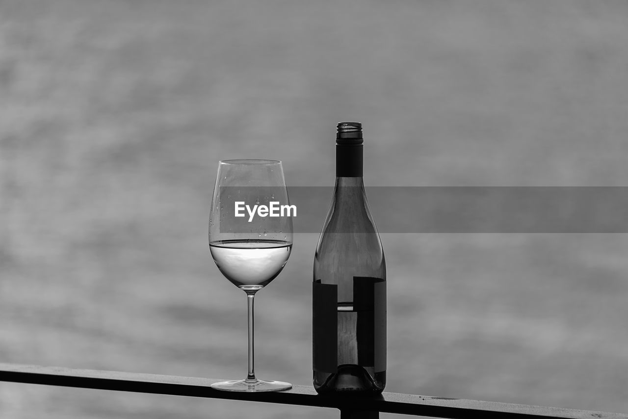 CLOSE-UP OF WINEGLASS ON TABLE