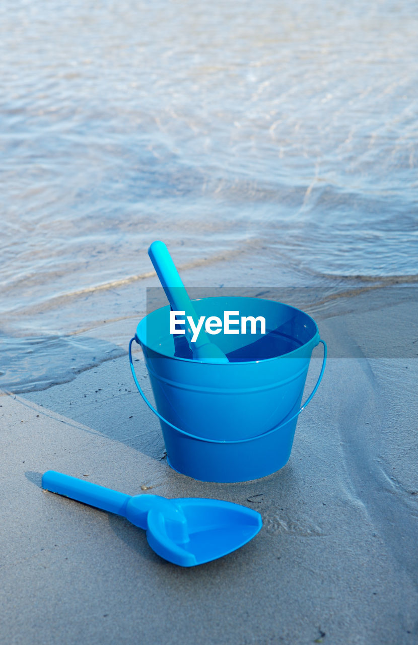 High angle view of bucket on beach