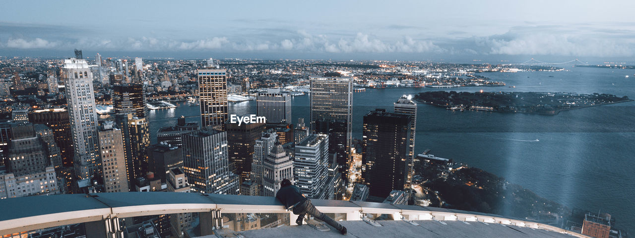 HIGH ANGLE VIEW OF BUILDINGS AGAINST SKY