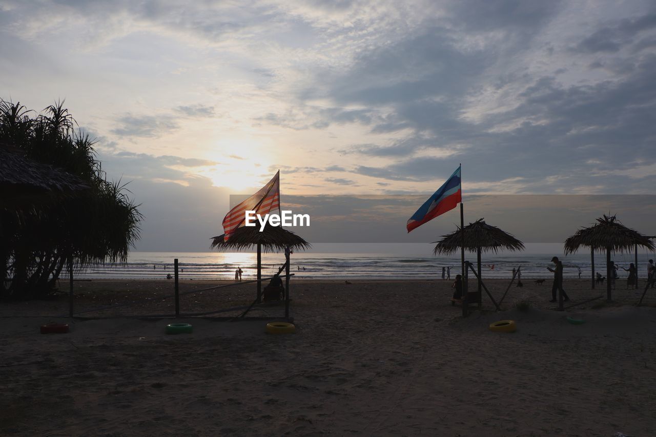 Scenic view of beach against sky during sunset