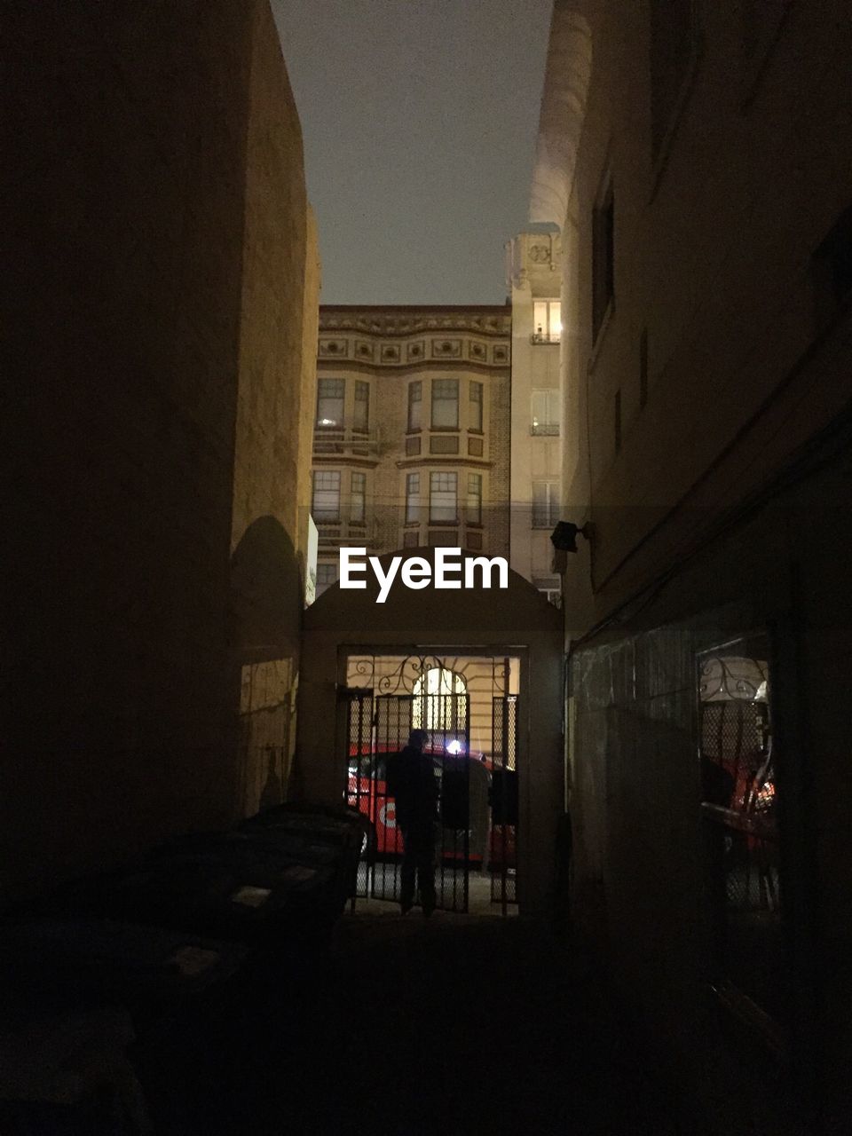 WOMAN STANDING IN BUILDING