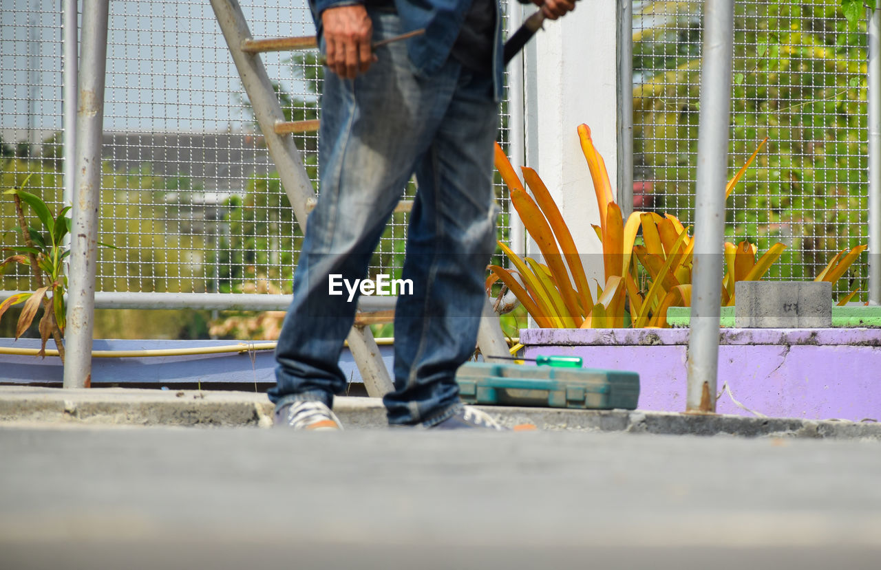 Low section of man working at construction site