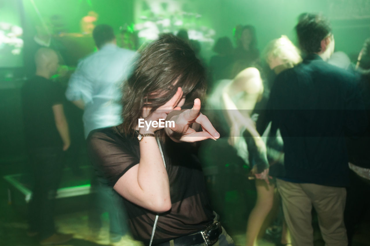 Young woman dancing in nightclub