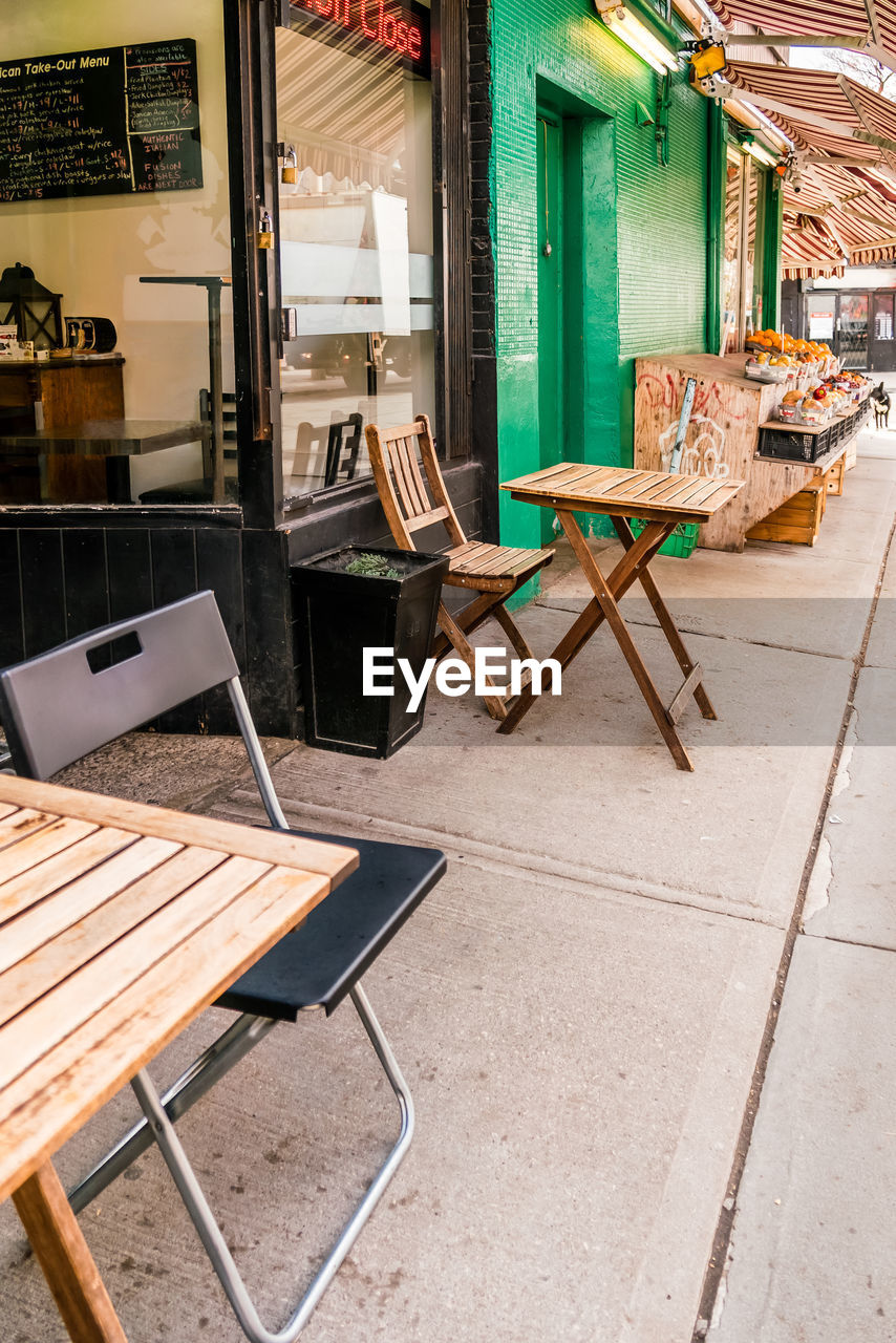 EMPTY CHAIRS AND TABLES IN RESTAURANT