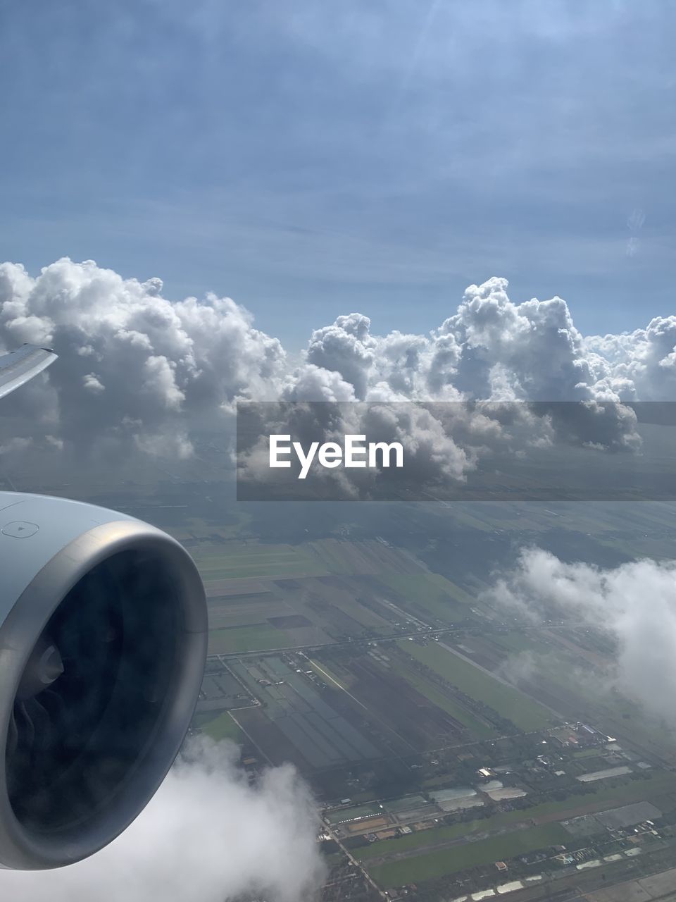 AERIAL VIEW OF CLOUDS OVER AIRPLANE